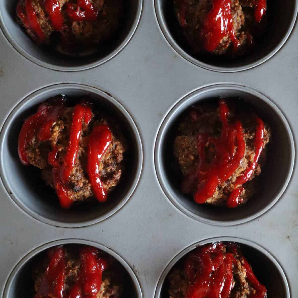 Photo of muffin tin with mini gluten free muffins with oats