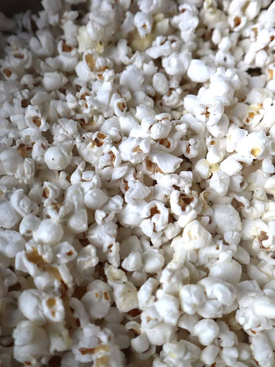 A very close photo of popped popcorn kernels